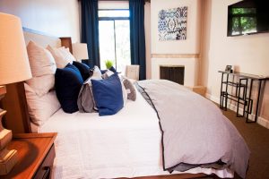 Furnished bedroom with throw pillows on bed, Design to Reflect, Gilbert AZ